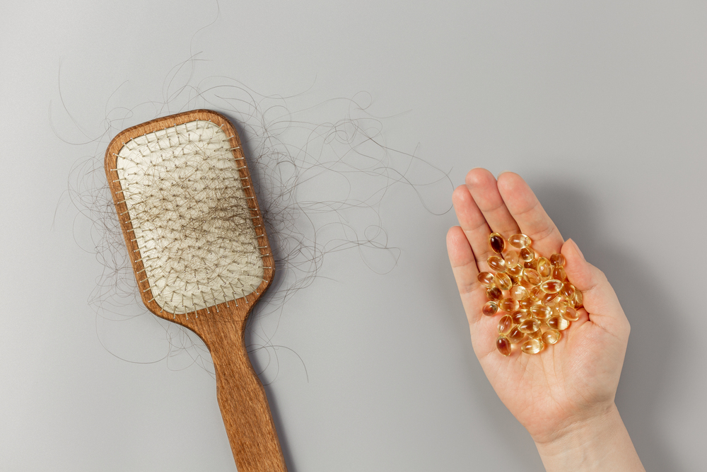 Vitamins next to a hairbrush