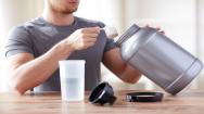 Close up of a man with a protein shake